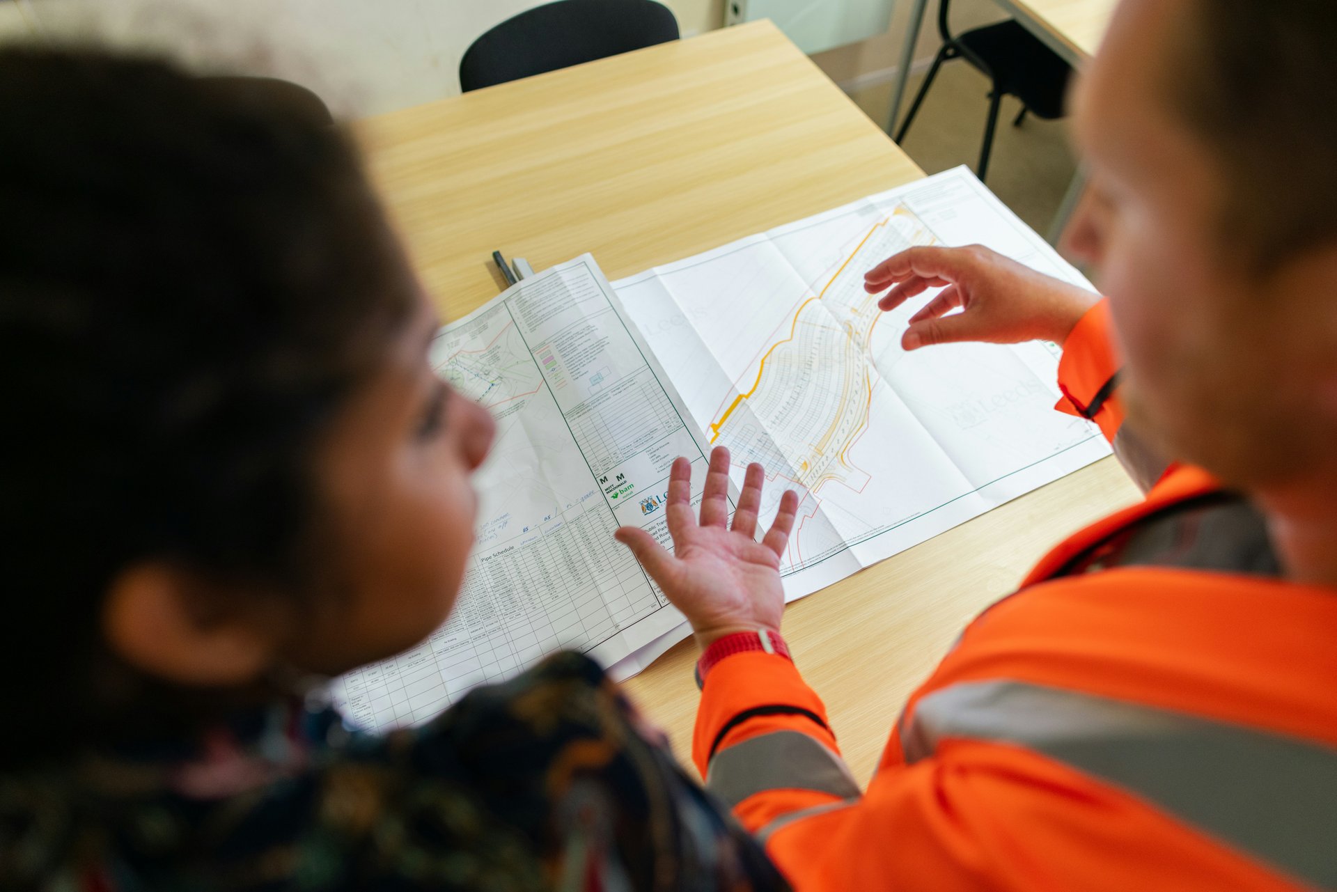 Certified professional electrician working on electrical panel with proper safety equipment and tools in Vancouver